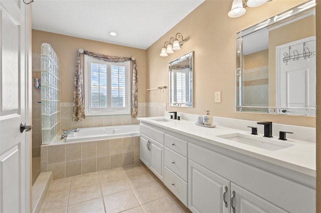 bathroom featuring tile patterned flooring, vanity, and independent shower and bath