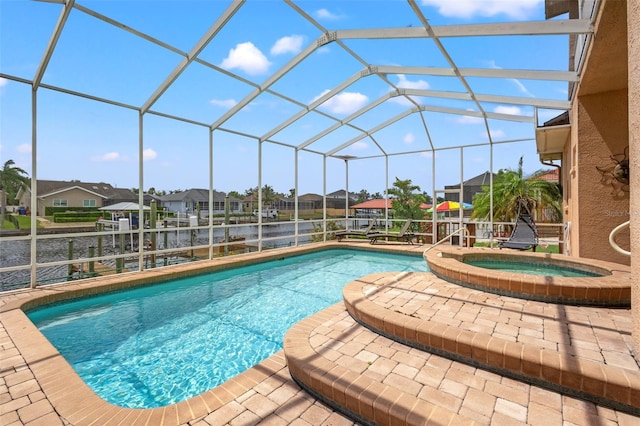 view of swimming pool with glass enclosure and an in ground hot tub