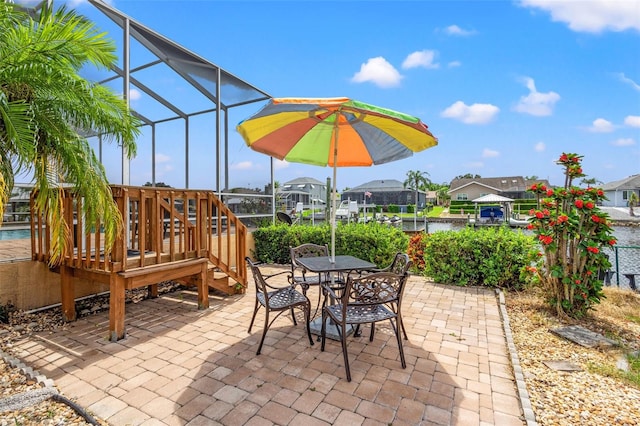 view of patio featuring a lanai