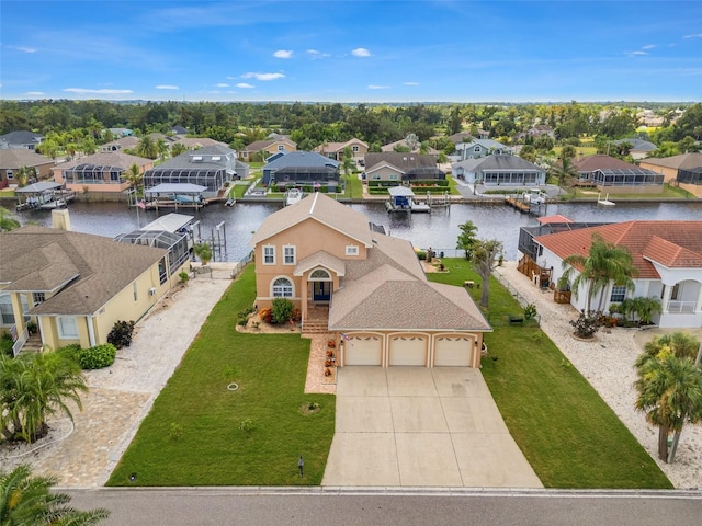 birds eye view of property featuring a water view