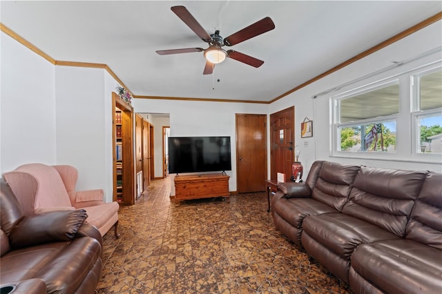 living room featuring ceiling fan and crown molding