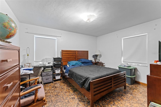 bedroom featuring a textured ceiling