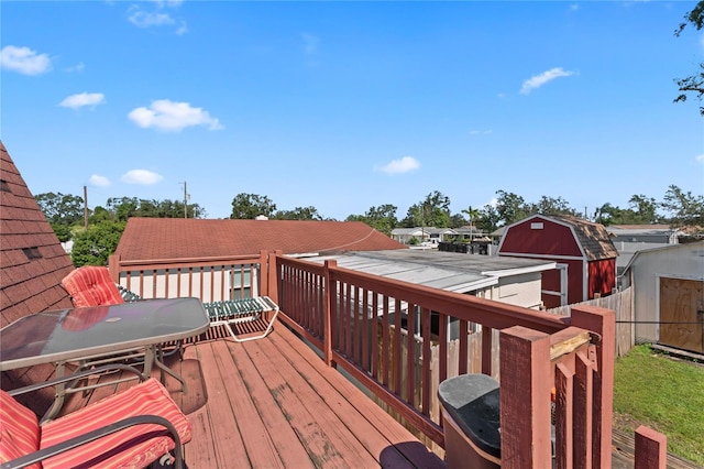 wooden terrace with a shed