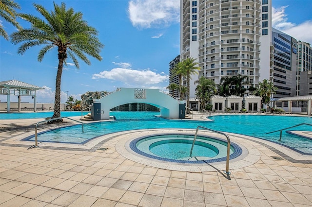 view of pool featuring a hot tub