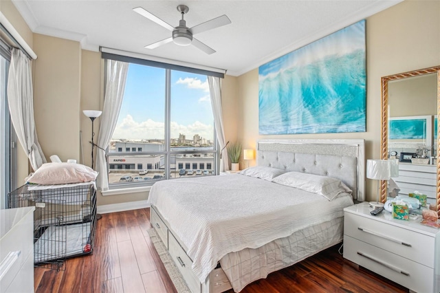 bedroom featuring ceiling fan, dark hardwood / wood-style flooring, and ornamental molding