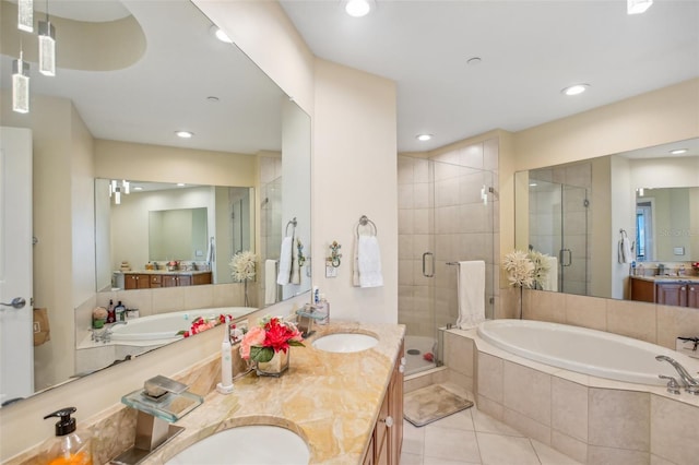 bathroom featuring tile patterned flooring, vanity, and independent shower and bath