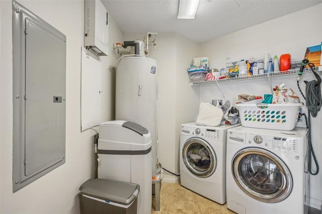 laundry room featuring washer and clothes dryer and a textured ceiling