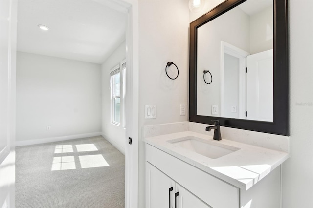 bathroom with vanity and baseboards