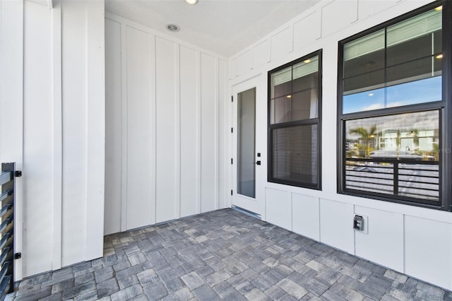 property entrance with board and batten siding