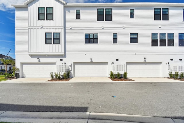 exterior space featuring an attached garage and board and batten siding