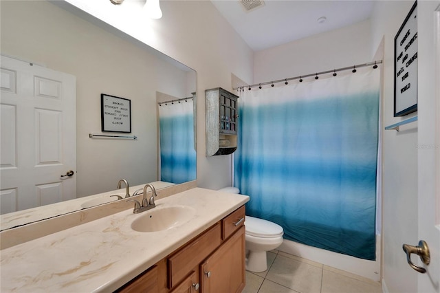 bathroom with tile patterned floors, vanity, and toilet