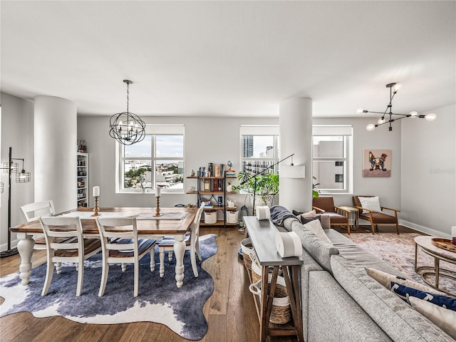 dining room with hardwood / wood-style floors, a wealth of natural light, and a chandelier