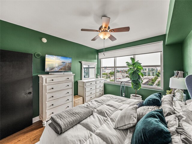 bedroom featuring light hardwood / wood-style flooring and ceiling fan