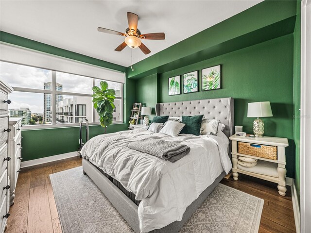 bedroom featuring ceiling fan and dark hardwood / wood-style floors