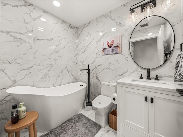 bathroom with tile walls, a tub, vanity, and toilet