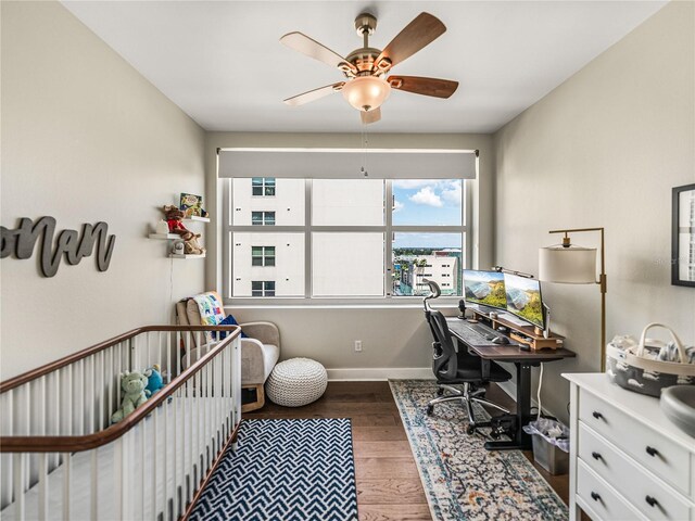 office area featuring ceiling fan and dark hardwood / wood-style floors