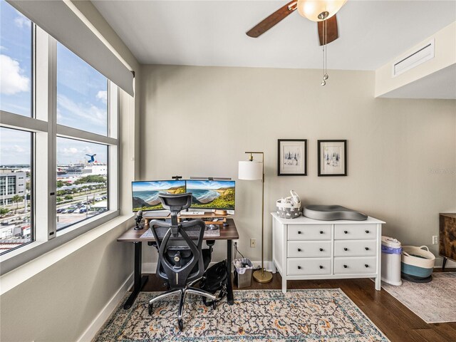 office featuring ceiling fan, dark hardwood / wood-style flooring, and a healthy amount of sunlight