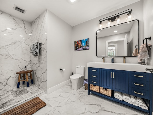 bathroom featuring toilet, vanity, and tile patterned floors