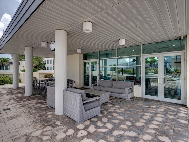 view of patio with an outdoor living space and french doors