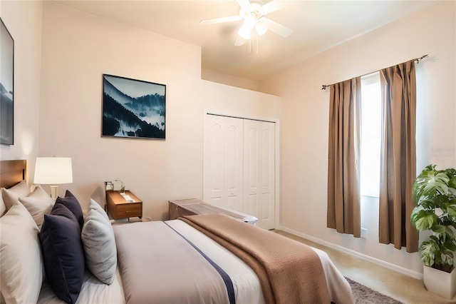 carpeted bedroom with a closet and ceiling fan