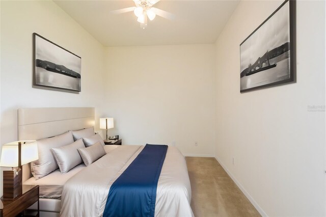 bedroom featuring ceiling fan and carpet