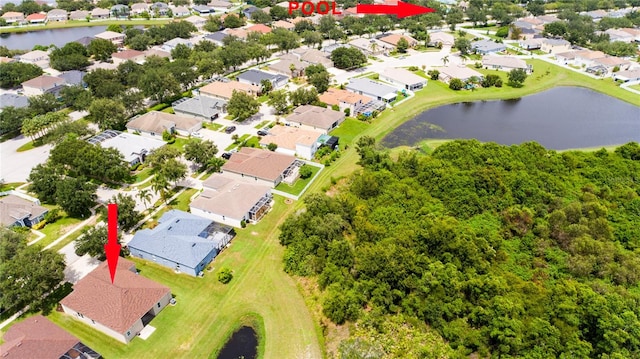 birds eye view of property with a water view