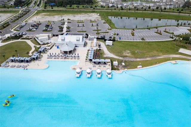 birds eye view of property featuring a water view