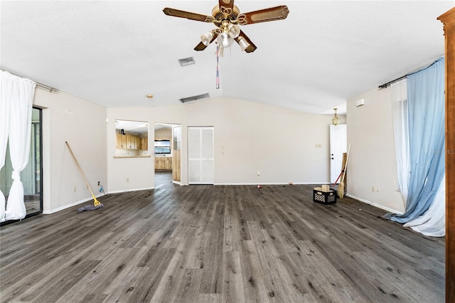 unfurnished living room with ceiling fan, dark hardwood / wood-style floors, and lofted ceiling