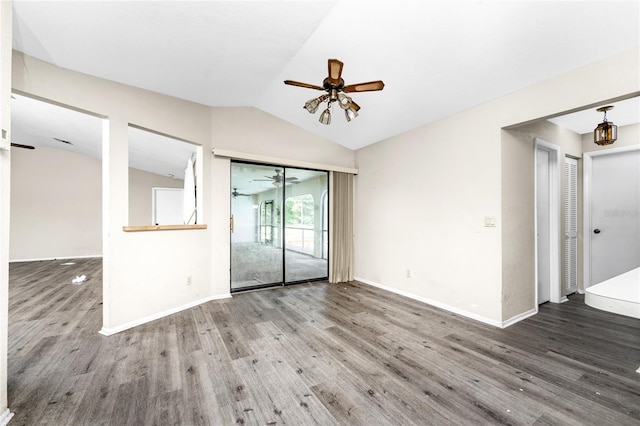 empty room with ceiling fan, vaulted ceiling, and hardwood / wood-style flooring