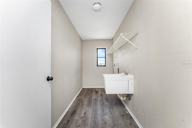 clothes washing area with hardwood / wood-style floors