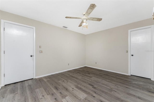 unfurnished room featuring hardwood / wood-style floors and ceiling fan