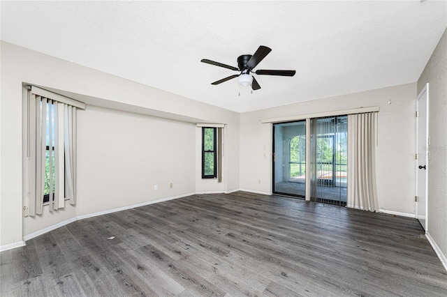 empty room with hardwood / wood-style floors and ceiling fan