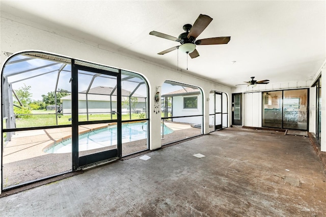 interior space with ceiling fan