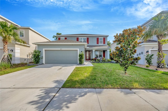 view of front of house with a front lawn and a garage