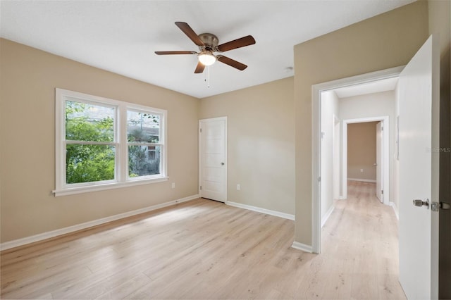 spare room featuring ceiling fan and light hardwood / wood-style floors