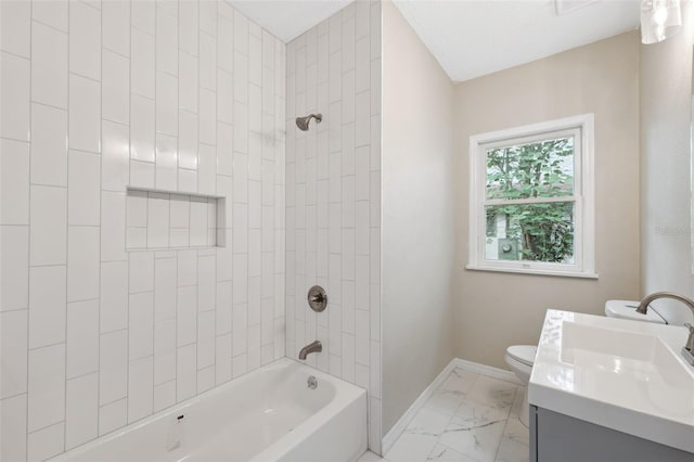 full bathroom with vanity, toilet, and tiled shower / bath