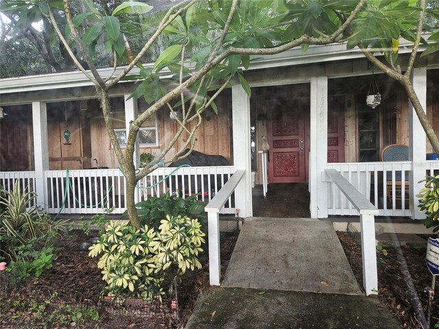 doorway to property with a porch