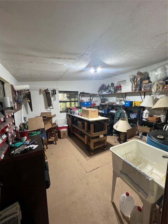 basement with a textured ceiling