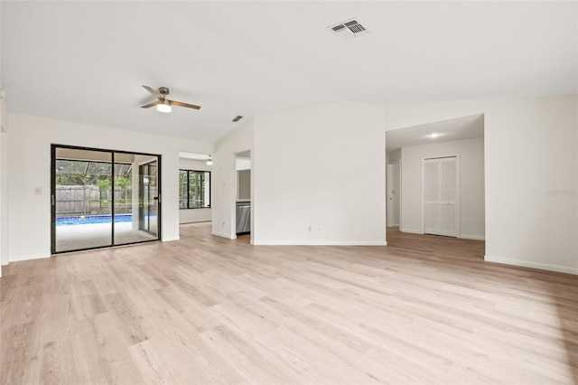 unfurnished room with ceiling fan, light hardwood / wood-style flooring, and lofted ceiling