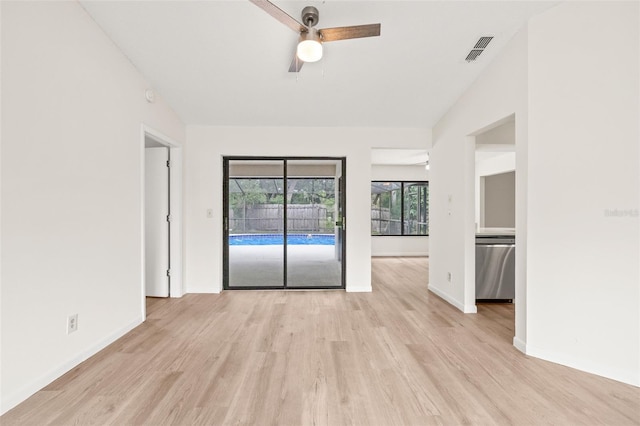 empty room featuring ceiling fan and light hardwood / wood-style floors