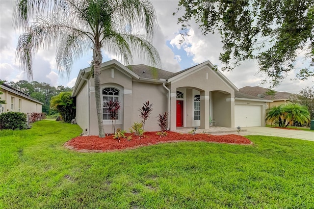 ranch-style house with a garage and a front lawn