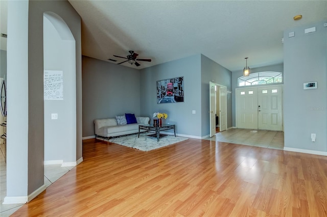 25954 Risen Star Dr, Wesley Chapel, FL 33544 - entryway featuring a textured ceiling, light hardwood / wood-style floors, and ceiling fan