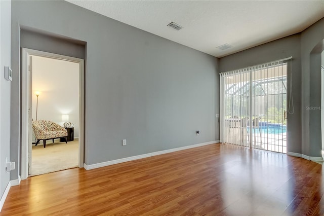 25954 Risen Star Dr, Wesley Chapel, FL 33544 - spare room featuring light hardwood / wood-style floors