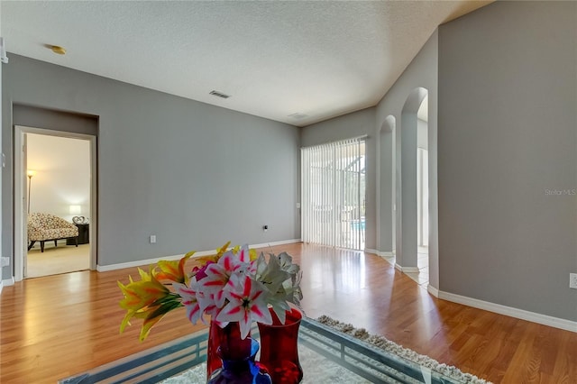 25954 Risen Star Dr, Wesley Chapel, FL 33544 - interior space with light hardwood / wood-style flooring and a textured ceiling