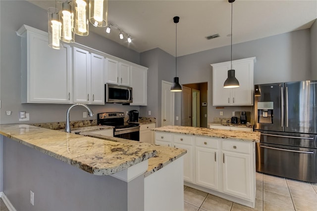 kitchen with white cabinets, stainless steel appliances, track lighting, and kitchen peninsula