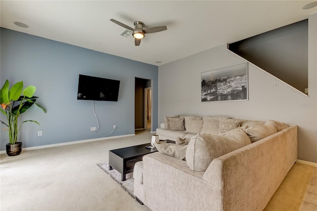 carpeted living room featuring ceiling fan