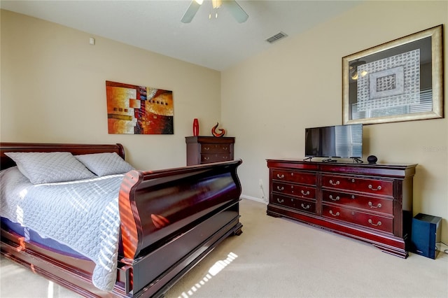 bedroom with ceiling fan and light colored carpet