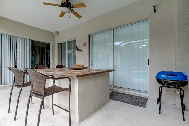25954 Risen Star Dr, Wesley Chapel, FL 33544 - view of patio featuring grilling area, ceiling fan, and a bar