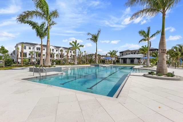 view of swimming pool with a patio