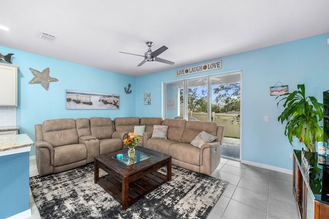 tiled living room featuring ceiling fan